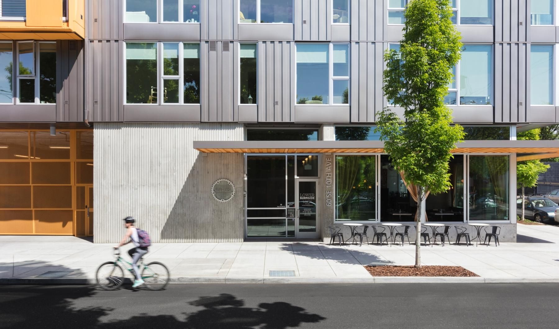 Settle into comfort at Lower Burnside Lofts a person riding a bicycle on the street