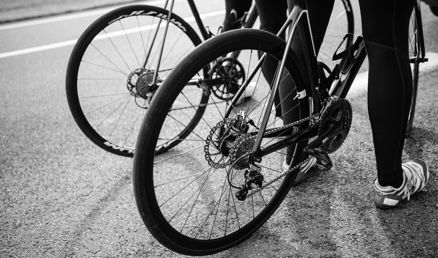 a person holding a bicycle