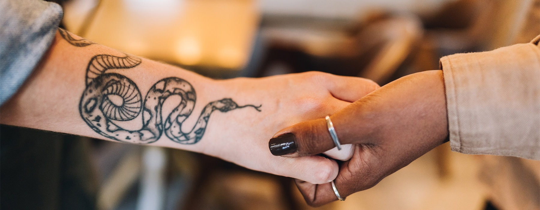Two hands holding each other