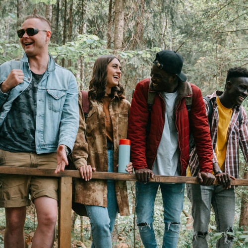 Everything within reach A group of friends take a break on a bridge while hiking