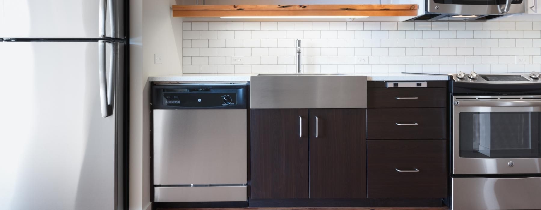 a kitchen with white cabinets